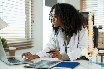Medical Technology Concepts The doctor is working on a tablet and  digital tablet computer in a...