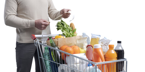 Man checking the grocery receipt