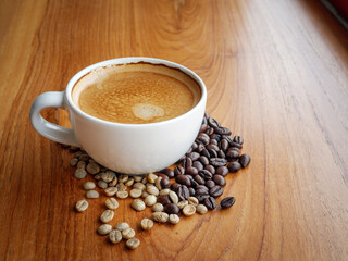 Espresso cup  coffee and coffee bean on wooden table in morning