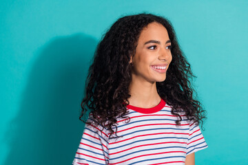 Fototapeta premium Photo portrait of pretty young girl look empty space wear trendy striped outfit isolated on cyan color background