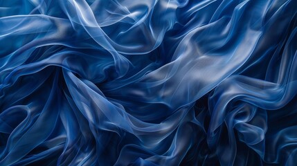 Obraz premium Flowing layers of royal blue fabric swirling and overlapping creating a dreamy ethereal effect.