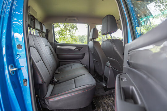 Moscow, Russia - June 2024: Blue pickup truck in the forest.  sollers st6 - Jac t6 - interior of SUV