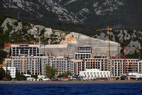 Čanj, Canj, Bar municipality, Montenegro, Europe - 09.2023 : Construction of AMMA Resort luxury hotel complex, front to the beach with Adriatic sea view, carved into  mountains