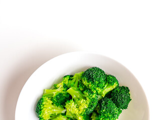 Broccoli on a large white plate. Love for broccoli.