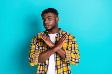 Photo of attractive confident man wear trendy checkered clothes crossed hands isolated on cyan...