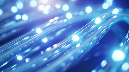 Illuminated blue fiber optic cables with blurred light. abstract background