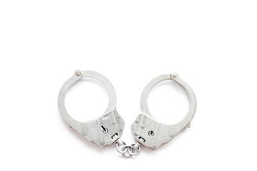 Close up police metal handcuffs, top view. Criminal law and justice concept
