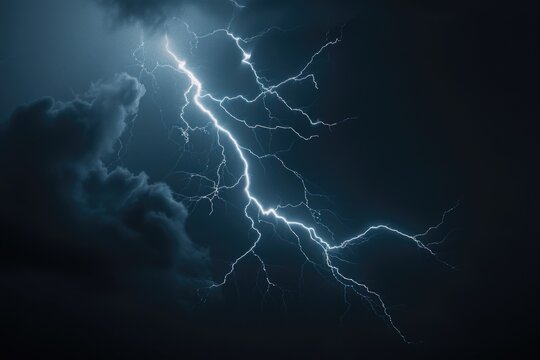 A lightning bolt illuminates the dark sky during a thunderstorm
