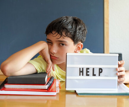 pre-adolescent boy asking for help, overwhelmed by homework