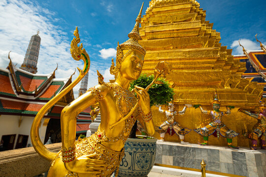 Golden angel statue at the Buddhist Temple Wat Phra Kaew grand Palace emerald buddhist temple
