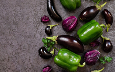 A variety of green peppers, cabbage and eggplant on the background of the old texture. Diet. Healthy eating theme background. View from above