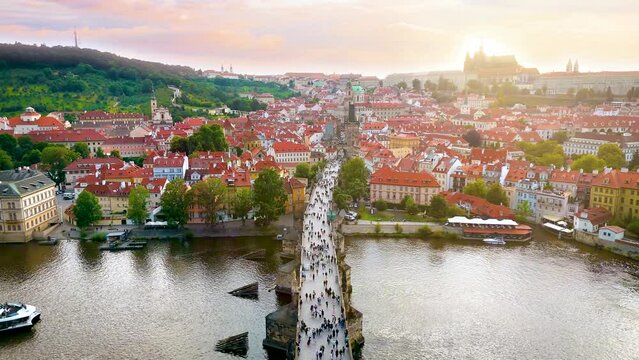 Aerial summer sunset view of the cityscape of Prague with Charles Bridge, Castle and old Lesser Town, Czech Republic