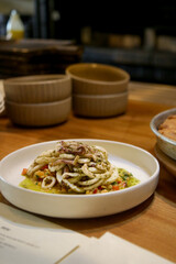 Delicious calamari salad served on the restaurant table