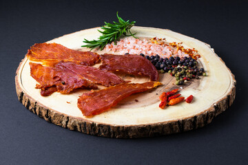 Beef jerky pieces isolated on a white and black background