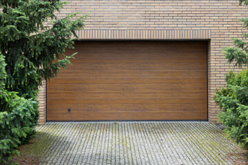 Closed Wooden Garage Door with Brick Wall