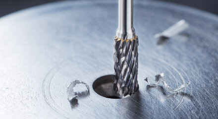 Milling cutter make sink in hole in steel billet. Locksmith work.