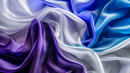 Fototapeta premium Silky, elegantly draped fabric in a mesmerizing blend of purple, blue, and white hues, creating a luxurious and soothing visual effect.