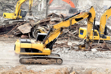 A modern excavator performs excavation work in the construction of a dam