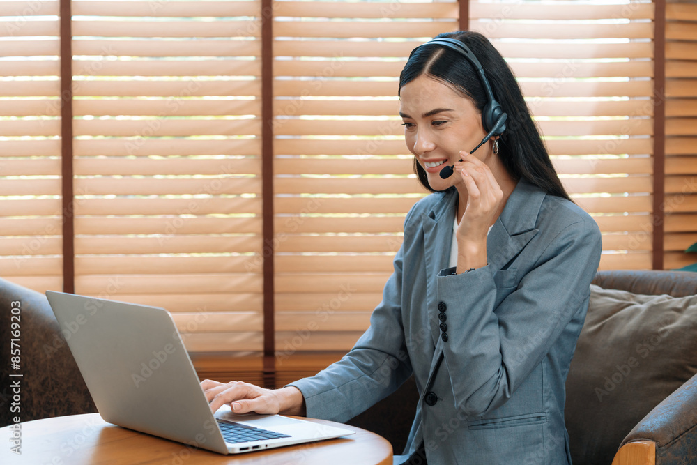 Aufkleber female call center operator or customer service helpdesk staff working on workspace while talking on