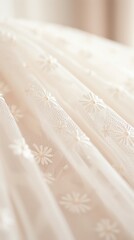 Obraz premium Elegant close-up of delicate, white floral lace fabric with intricate embroidered pattern, ideal for backgrounds or textile-themed projects.