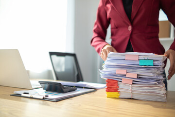 A pile of documents that the secretary has prepared for meetings of the company board of directors...
