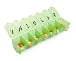Different pills in organizer isolated on white