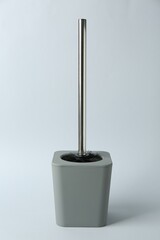 Toilet brush and holder on white background