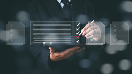 Checklist and filling survey form online. Document management system, DMS. Assessment form, questionnaire, checklist and clipboard task management. Businessman working checklist survey on tablet.