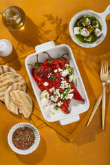 Grilled Peppers with Feta Cheese and Pita Bread on a Rustic Table for a delicious appetizer