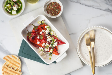 Grilled Peppers with Feta Cheese and Pita Bread on a Rustic Table for a delicious appetizer
