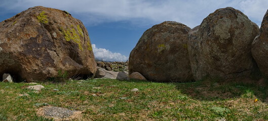 Kyrgyzstan, Cholpon-Ata. Huge stones scattered over a large area in the open-air museum of...