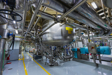 Stainless vertical steel tanks and pipes with pressure meter in equipment tank chemical cellar at the with stainless steel