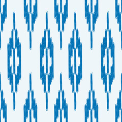 Seamless ikat pattern with blue geometrical elements on white background.