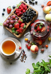 fruit tea in a teapot with fresh berries
