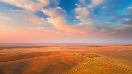 aerial view of open fields at sunset