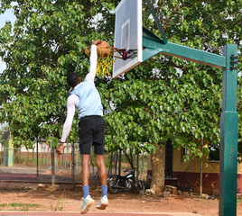 african basketball player making slam dunk © Vic Josh