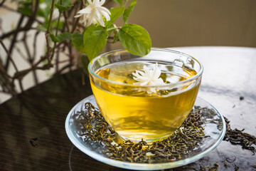 Organic Green Tea with Jasmine Flower and Jasmine Tea with Dried Leaves on tea cup