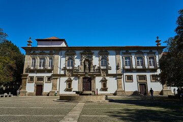 narrow streets in the city center of downtown Guimaraes with historical architecture in traditional...