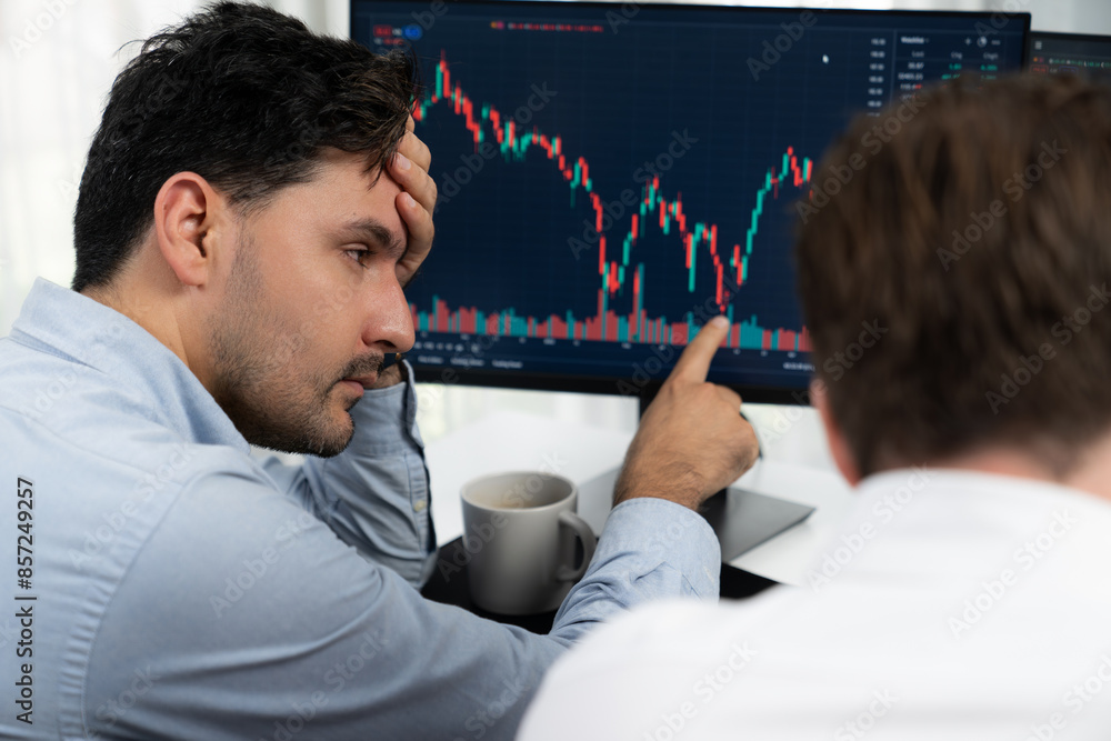 Aufkleber investor stock trading with serious face sharing with coworker while drinking coffee by using smartp