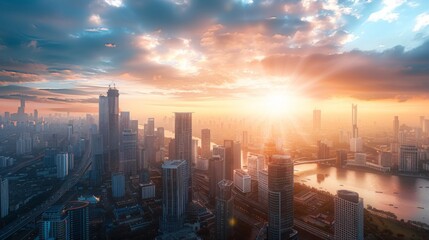 Fototapeta premium A panoramic view of a city skyline with the sun rising behind towering skyscrapers, illuminating the urban landscape.
