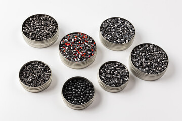 Pneumatic bullets for air gun. Set of bullets for air rifle. Sporting accessories for sport shooting. Set of bullets on white background