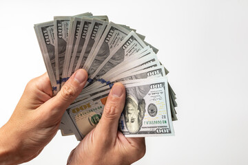 Contributions to business. American money is in the hands of a man. Dollars in hand. The concept of...