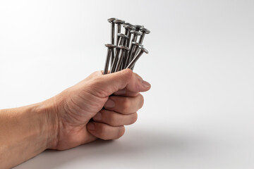 Iron nails on a white background