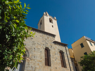 Back view of church of San Giovanni Battista in Riomaggiore village of Cinque Terre, This basilica is located in the upper part of the historic center. Italian Riviera, Liguria, Italy