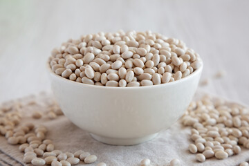 Organic White Beans in a Bowl, side view.