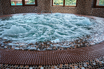 Clean water with bubbles in the jacuzzi. Rest in the spa. Selective focus
