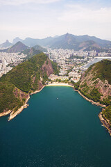 Aerial view, water and buildings in city, mountain and architecture in Brazil, tourism and destination. Morning, location and outdoor in Rio De Janeiro, ocean or explore in vacation and nature in sea