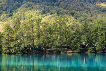 Fototapeta premium View of Lower Blue Lake near the village of Babugent Chereksky district, Kabardino-Balkarian Republic, Russia. Cherek-Kel Lake.