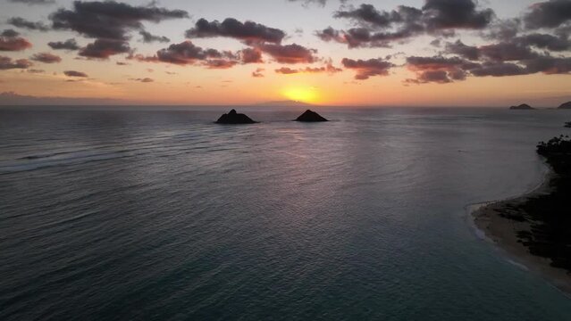 Sunrise over Moke Islands (Na Mokulua) in Lanikai on Oahu, Hawaii
