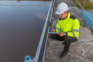 Environmental engineers work at wastewater treatment plants,Water supply engineering working at Water recycling plant for reuse